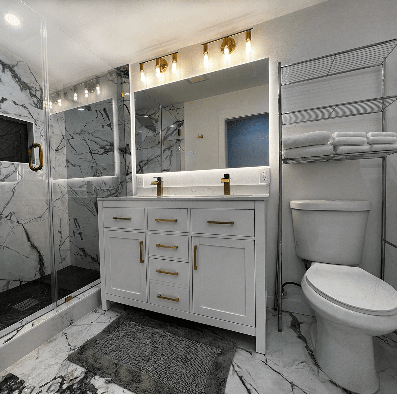 Modern bathroom with marble and gold accents